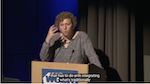 Alyssa Goodman speaking at a podium at WGBH opening